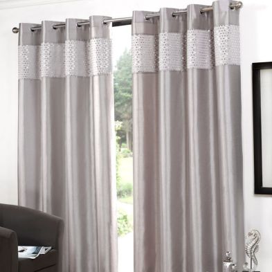 See more information about the Glitz Eyelet Curtains (45" Width x 54" Drop) - Silver